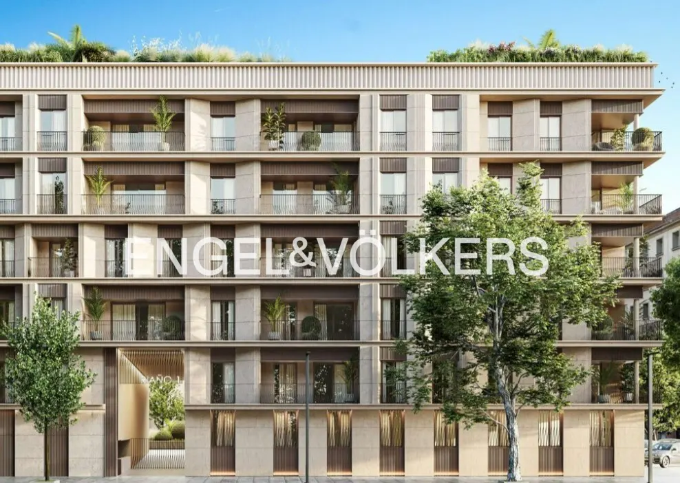 Exterior of a modern, multi-story apartment building with balconies and the Engel & Volkers logo.