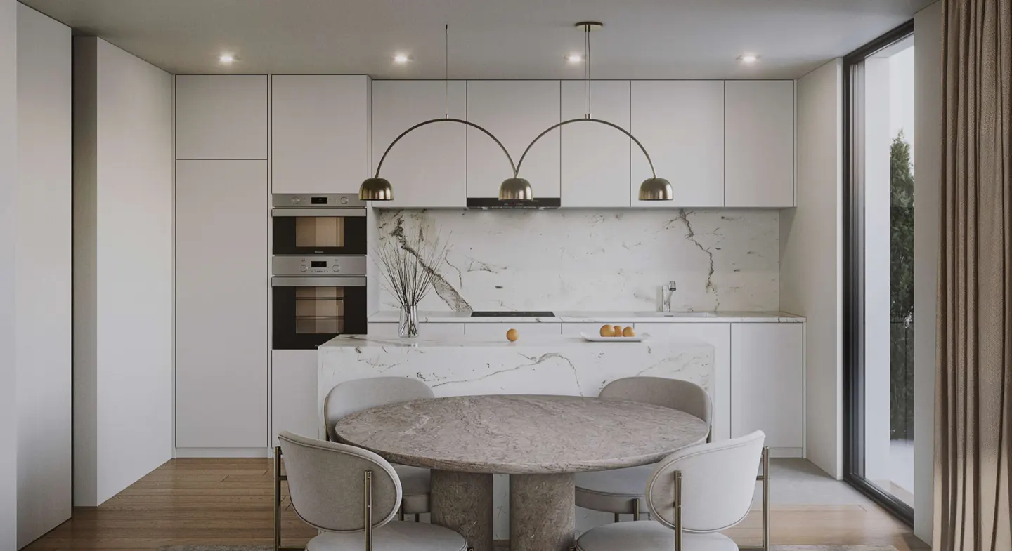 Bright kitchen with white cabinets, marble backsplash, and a round stone table with four chairs. A modern light fixture hangs above the island.