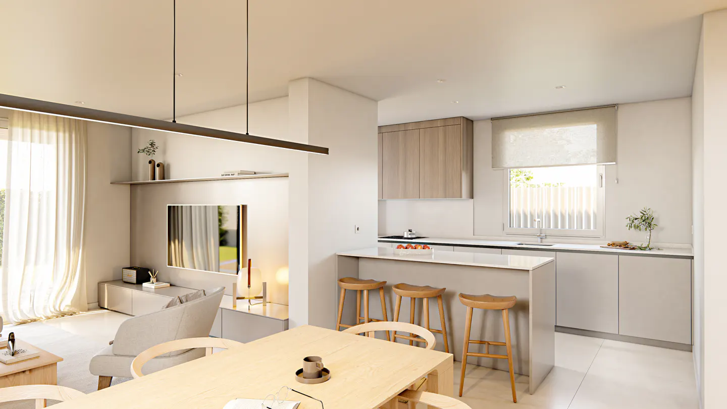 Open-concept living space with a light wood dining table, kitchen island with stools, and a living room with a TV.