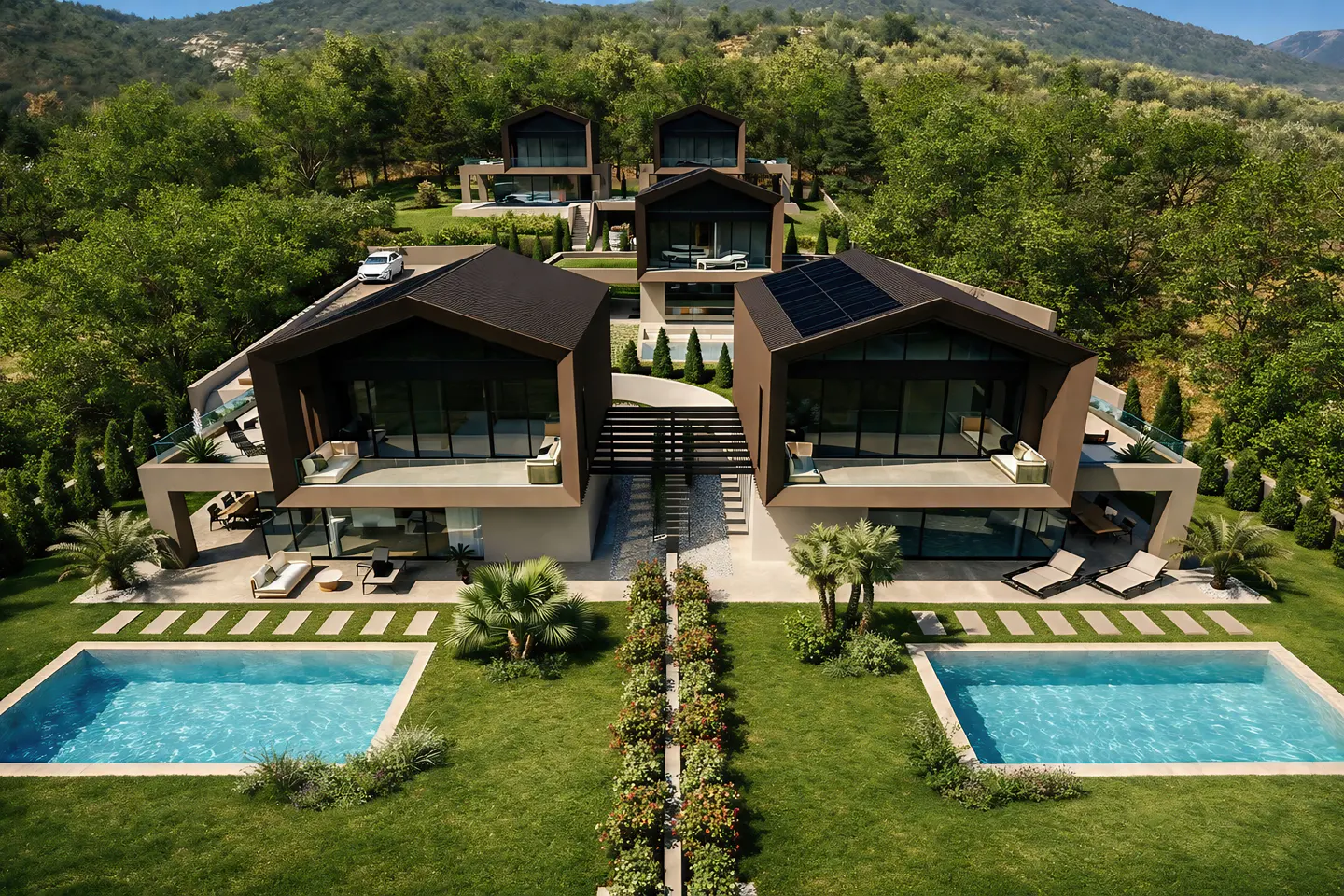 Aerial view of modern brown houses with pools, surrounded by green trees and a mountain backdrop.