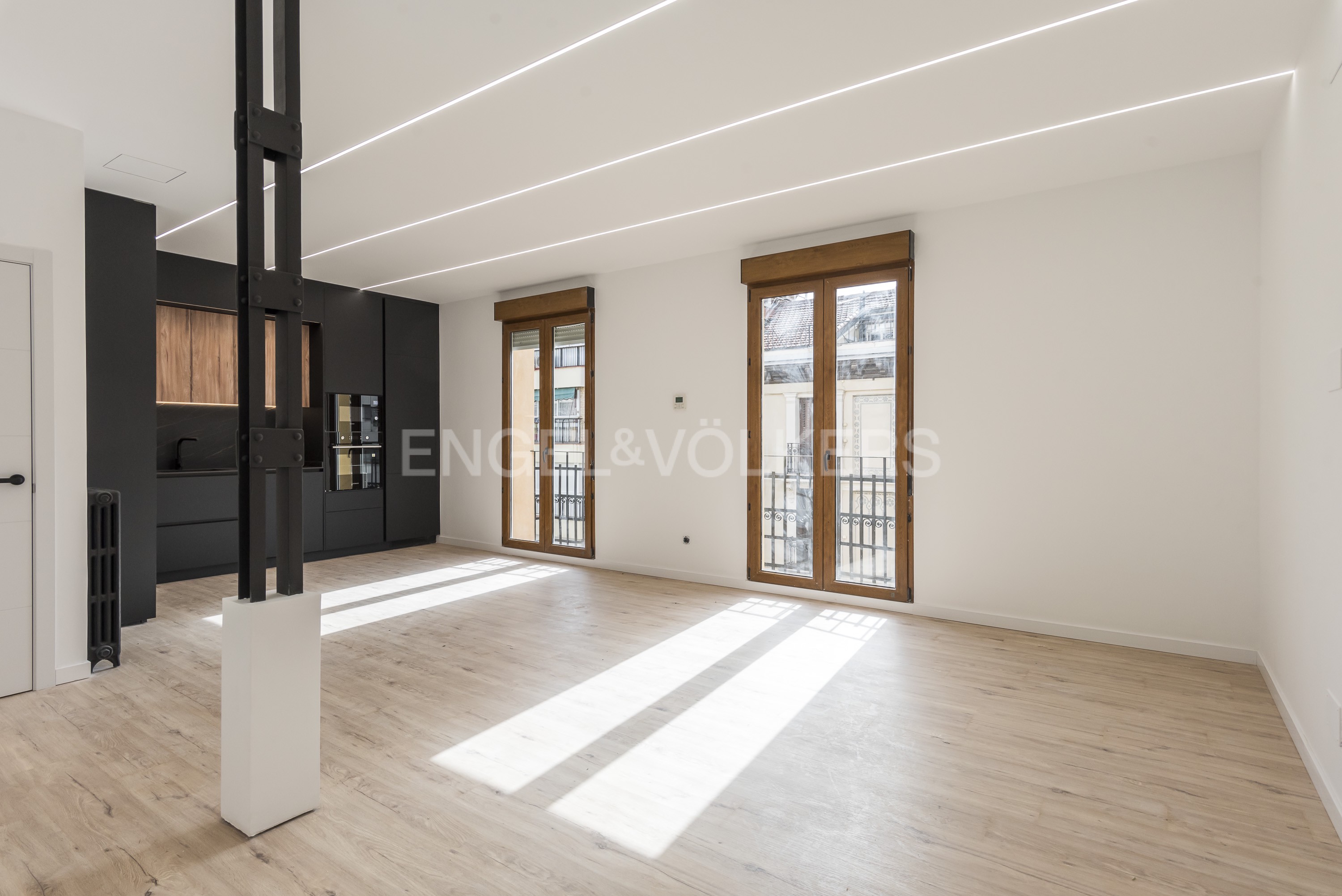 Renovated exterior apartment with small terraces; long-term rental; primary residence.