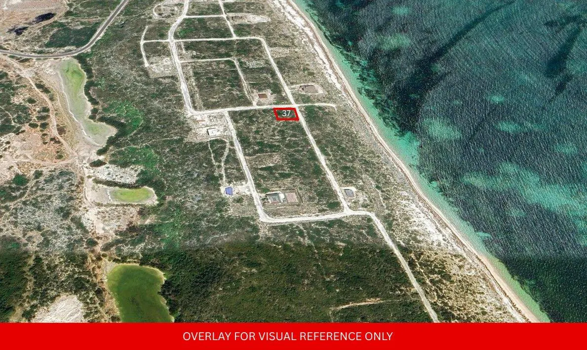 Aerial view of land plots near the ocean, with plot 37 highlighted in red. Green vegetation and blue water visible.