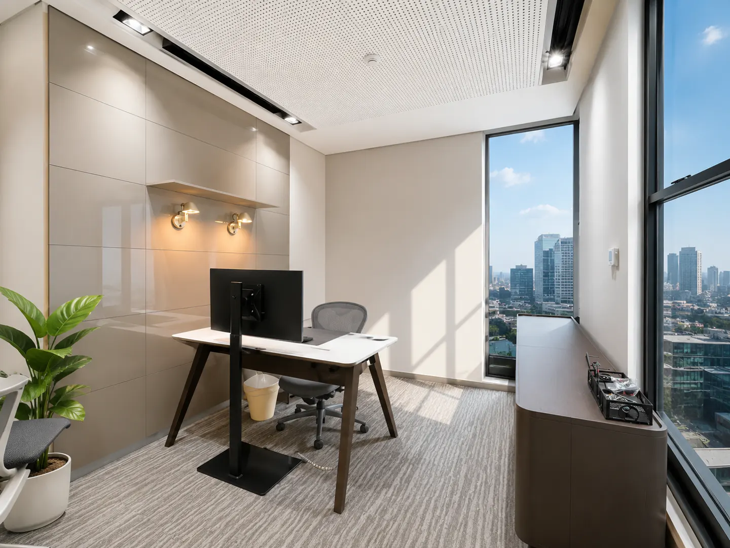 Modern office with a desk, computer monitor, and chair, featuring a large window with a city skyline view.