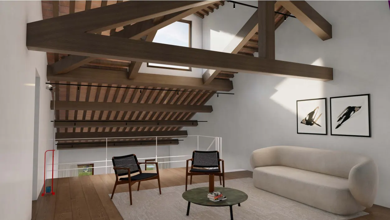 Interior view of a living room with exposed wooden beams, white walls, a beige sofa, and two chairs. Two framed bird prints hang on the wall.