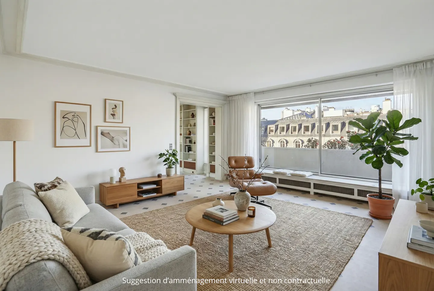 Bright living room with a gray sofa, brown leather chair, and a large window overlooking Parisian buildings. A round wooden table sits on a jute rug.