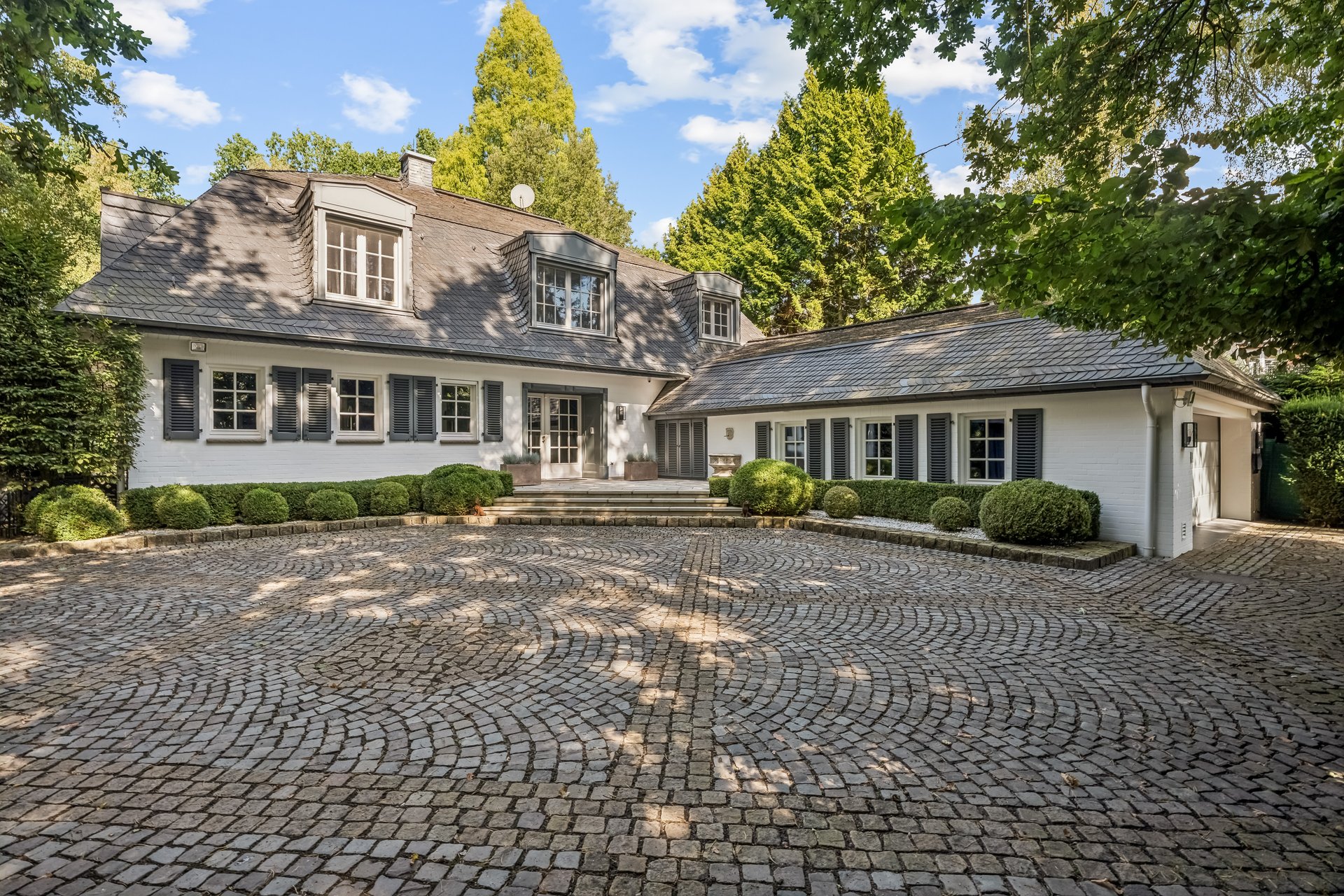 Representative villa on park-like grounds in the exclusive Forest Lake residential area