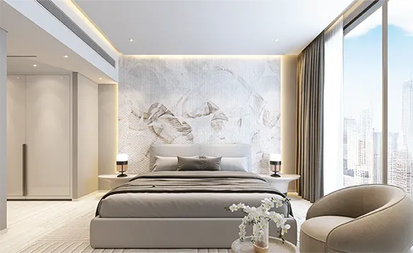 Modern bedroom with a king bed, floral wallpaper, and a city view from a large window. A beige armchair sits near a small table with white flowers.