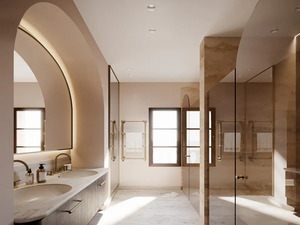 A modern bathroom with marble floors, a double sink vanity, and a glass-enclosed shower. The walls are beige, and the fixtures are gold.