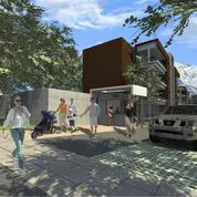 A modern brown and white house with people walking on the sidewalk and a car parked in front.