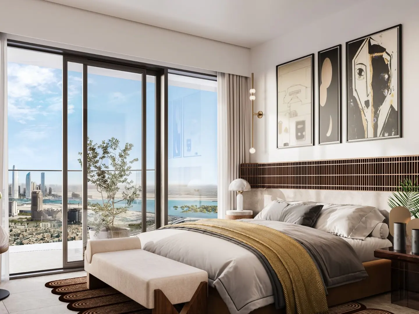 A modern bedroom with a large window overlooking a city skyline and ocean. The bed has a brown headboard, white linens, and a yellow throw. Three framed art pieces hang on the wall.