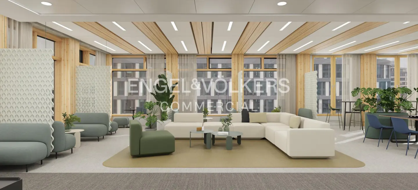 Engel & Volkers commercial space with white sofas, green chairs, plants, and large windows.