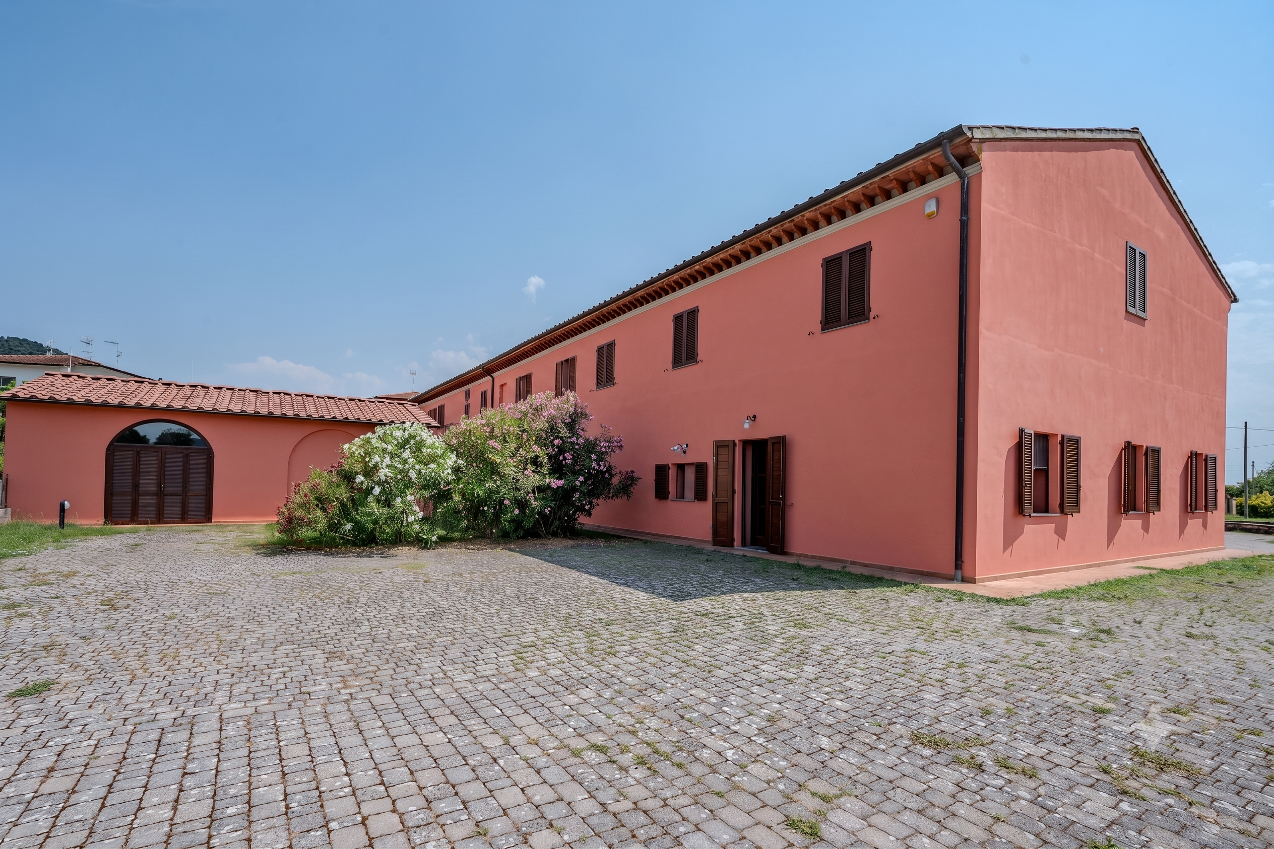 Portion of Tuscan farmhouse with garage