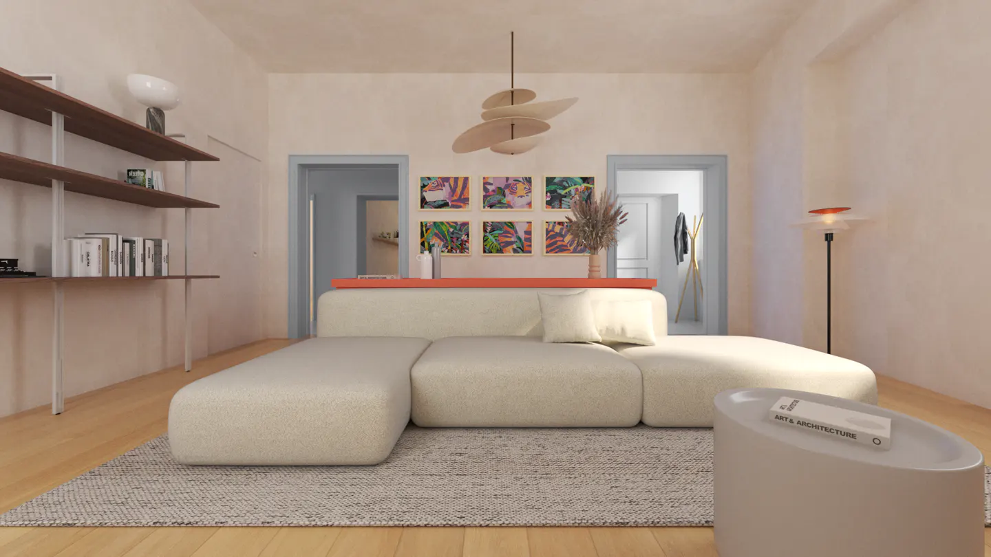 Living room with a cream sectional sofa, a light gray rug, and a white side table with a book on it. There are shelves on the left and artwork on the wall.