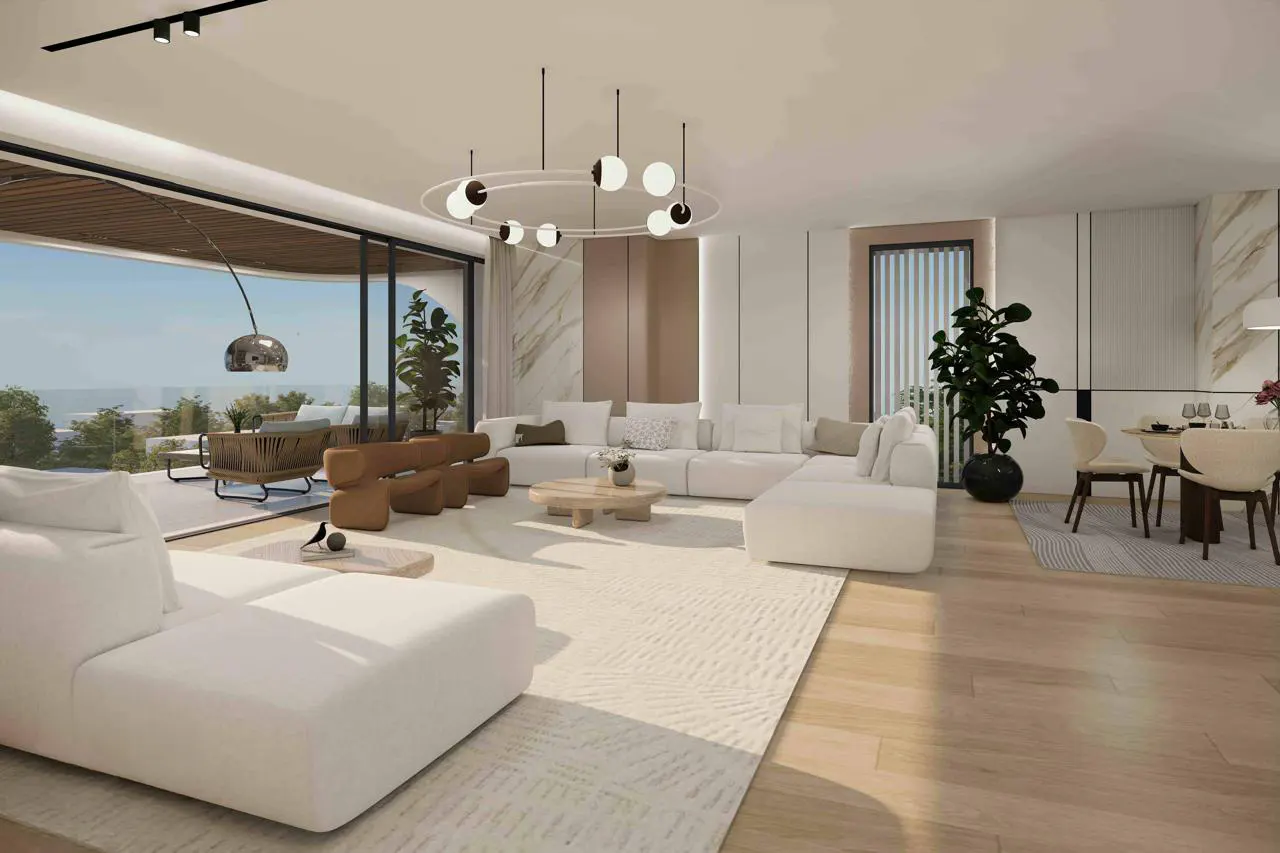 Modern open-plan living room with white sectional sofas, a circular chandelier, and a balcony overlooking the outdoors.