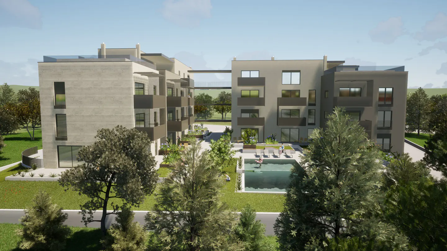 Exterior view of modern apartments with balconies, a pool, and a connecting skywalk, surrounded by green trees and grass.