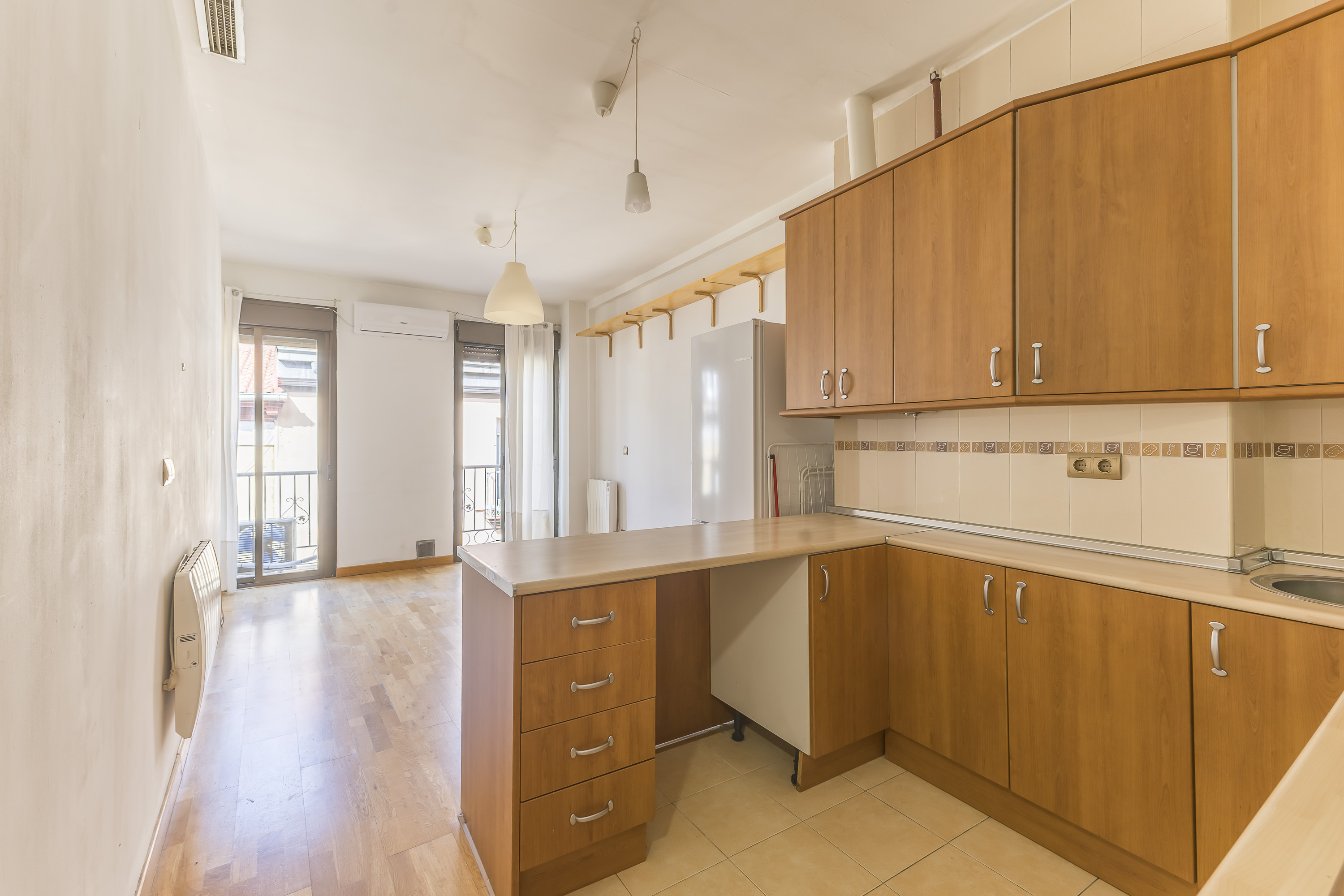Bright exterior apartment featuring 2 balconies with street views.