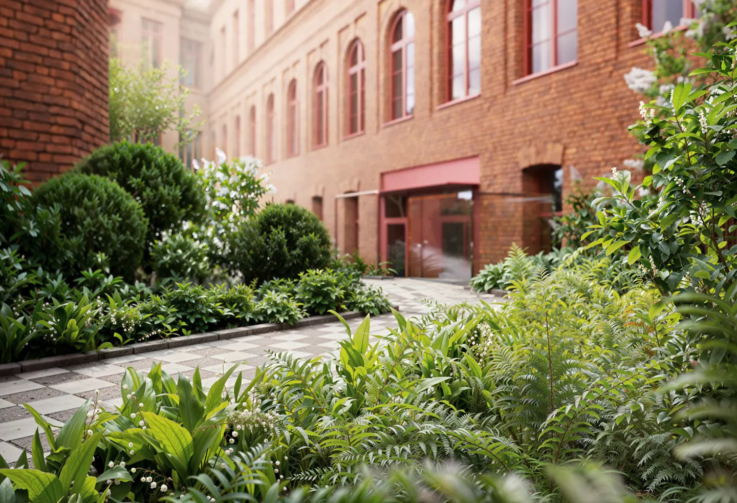 Brick building with arched windows and a checkered walkway surrounded by lush green plants.