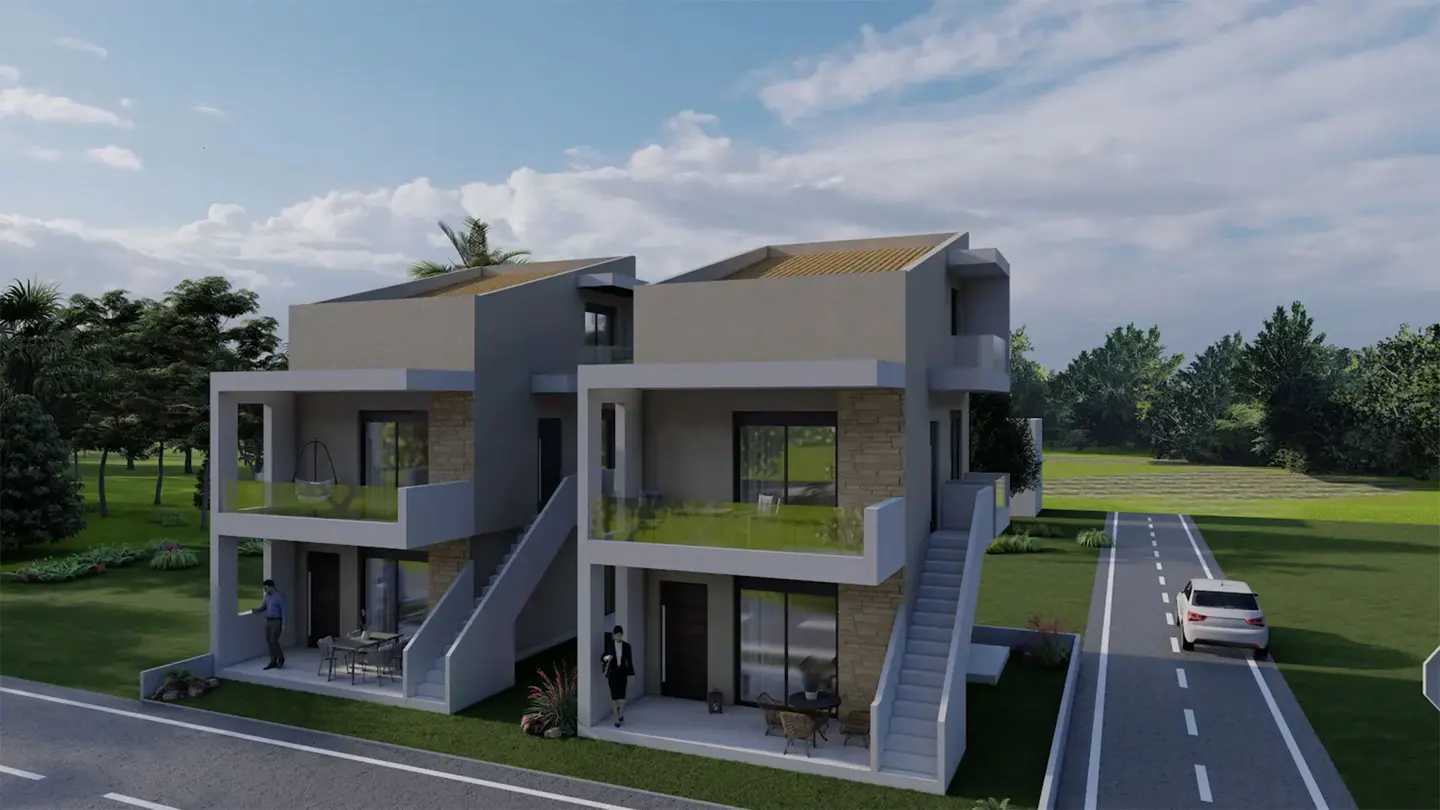 A modern two-story duplex with stone accents, glass balconies, and outdoor stairs, set in a green landscape with a road.