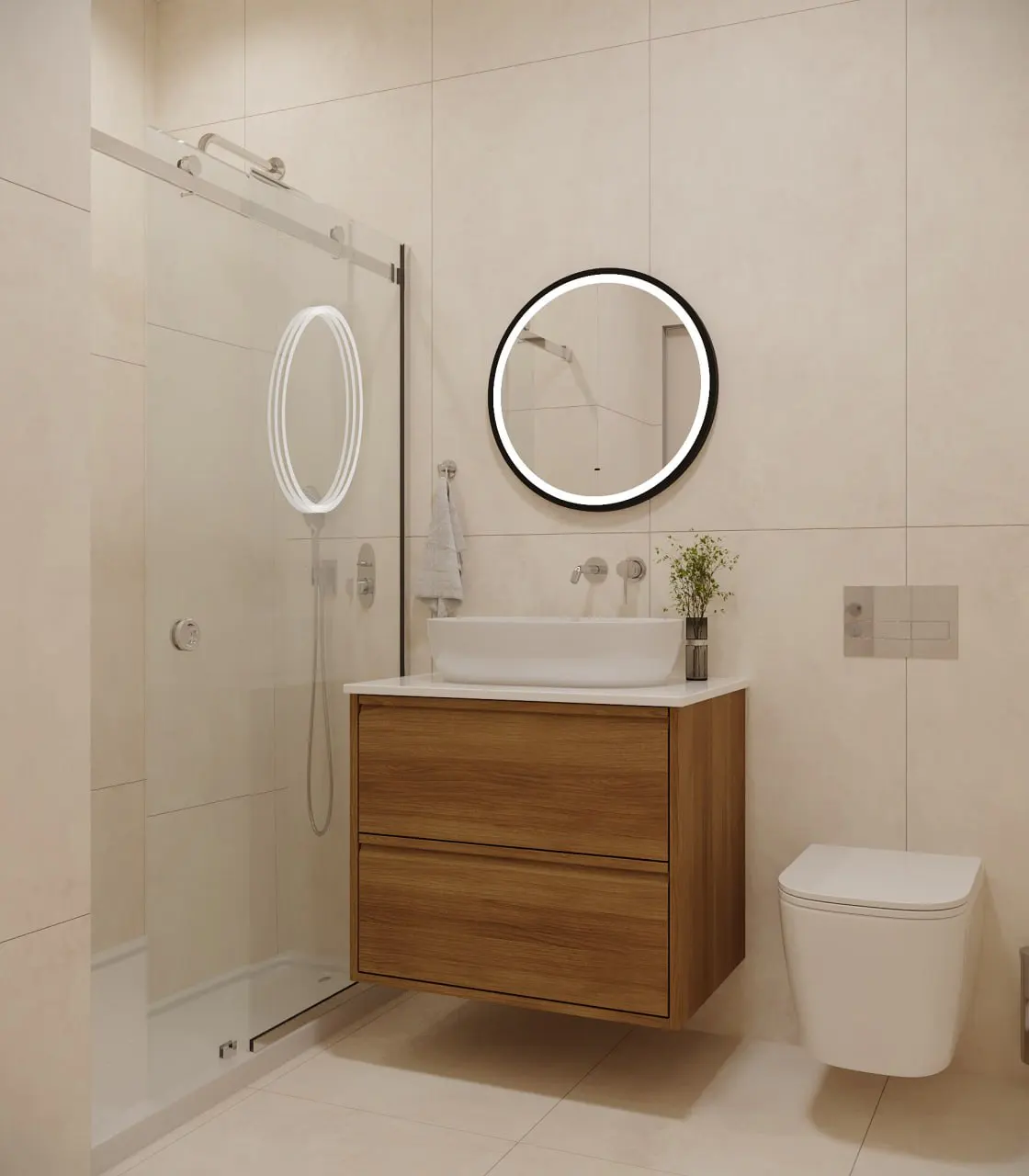 Bright bathroom with a glass shower, wood vanity with a white sink, and an oval mirror with a black frame. A white toilet is on the right.