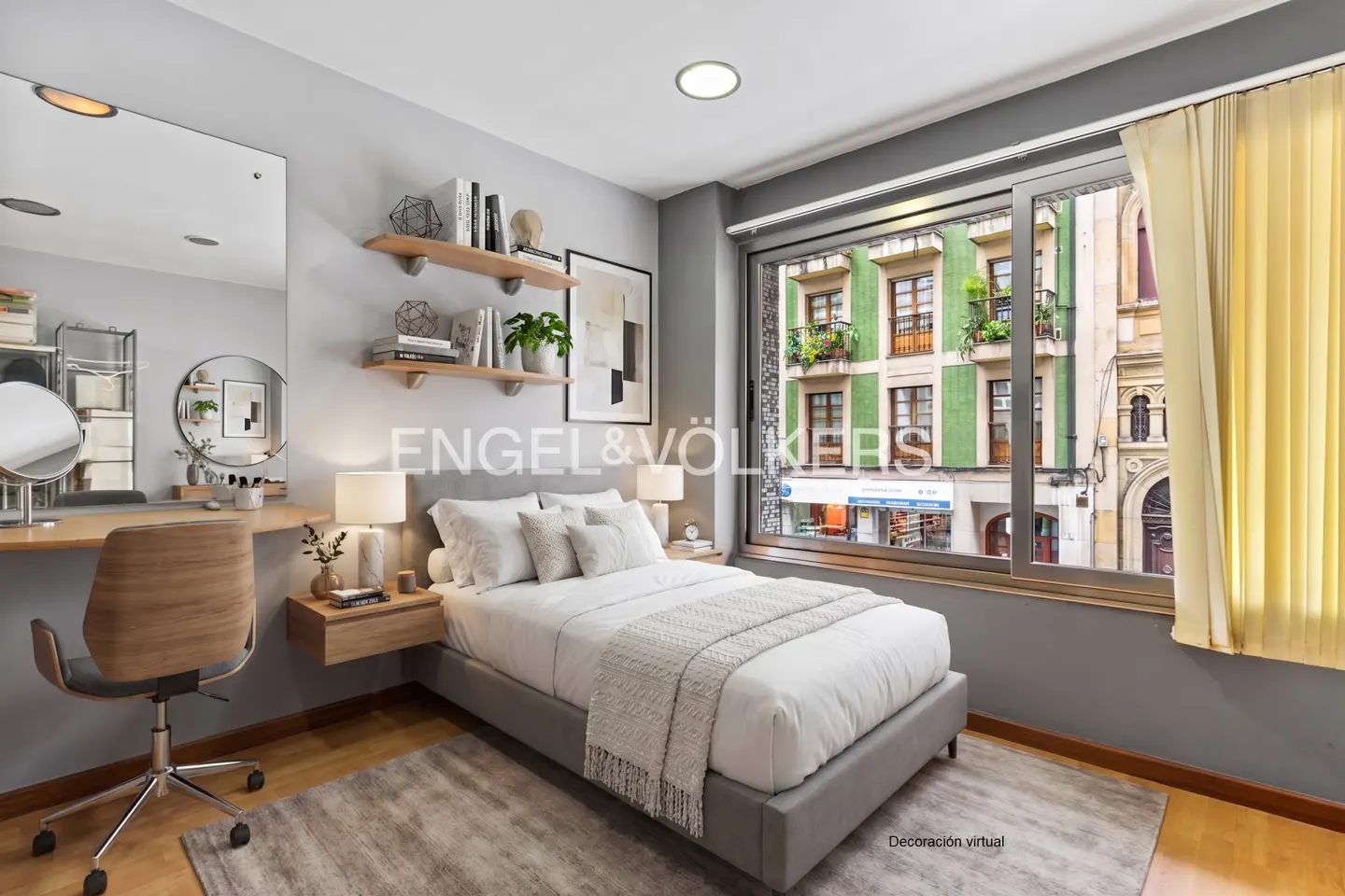 Bedroom with gray walls, wood floors, a gray bed, and a window view of a green building.