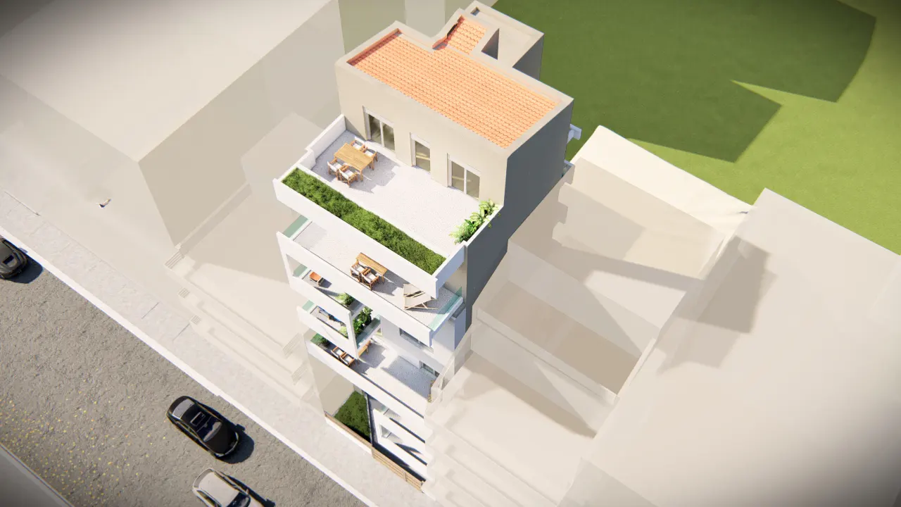 Aerial view of a modern white building with balconies, green plants, and a rooftop terrace with orange tiles. Cars are parked on the street.
