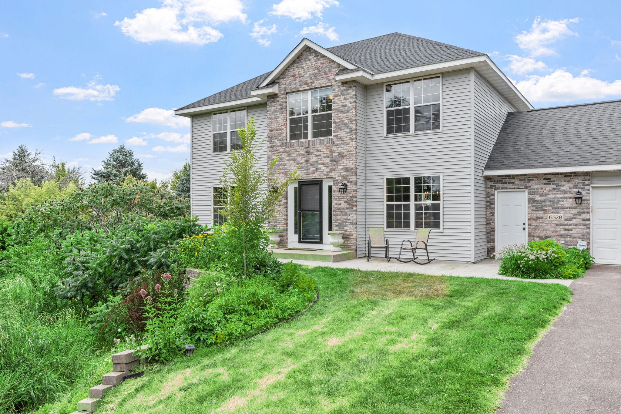 Refreshed 5-Bed Walkout on 1-Acre Forest Lake Lot