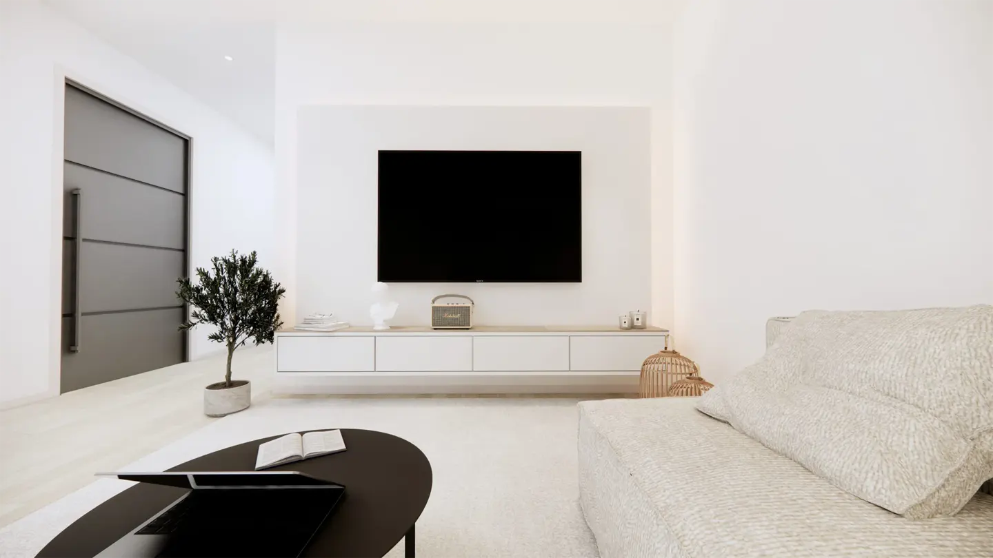 Minimalist living room with white walls, a black TV, a gray door, and a black coffee table.