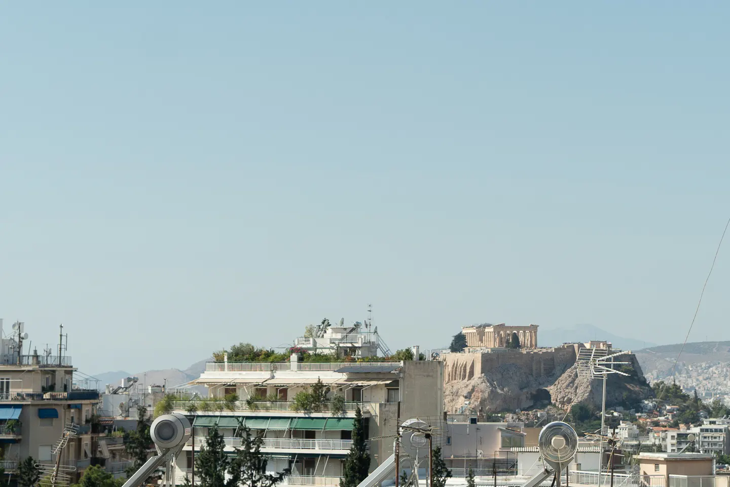 Athens cityscape view with the Acropolis in the background on a clear day.