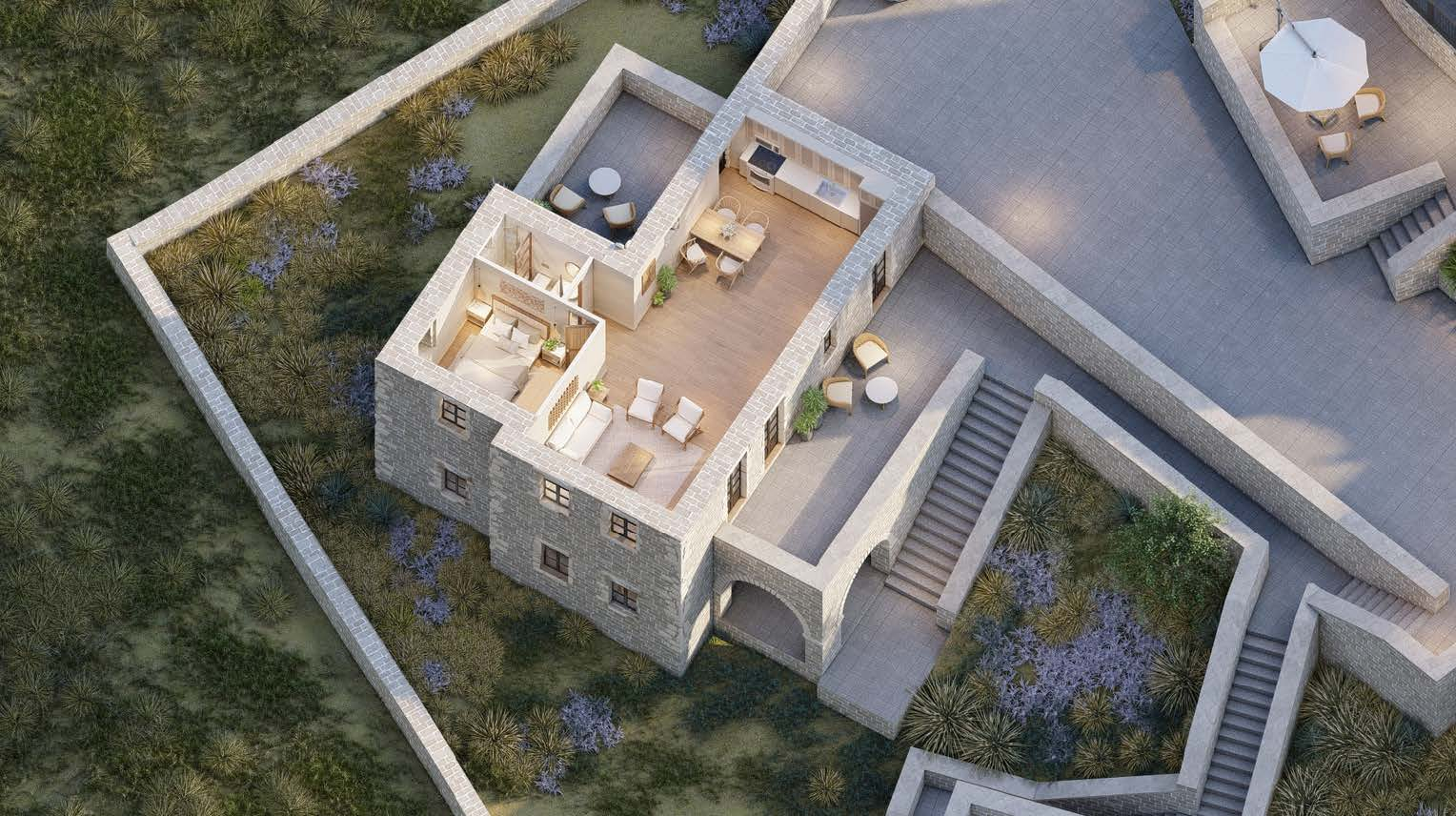 Aerial view of a stone villa with an open-plan interior, wooden floors, a bedroom, and outdoor terraces with stairs.
