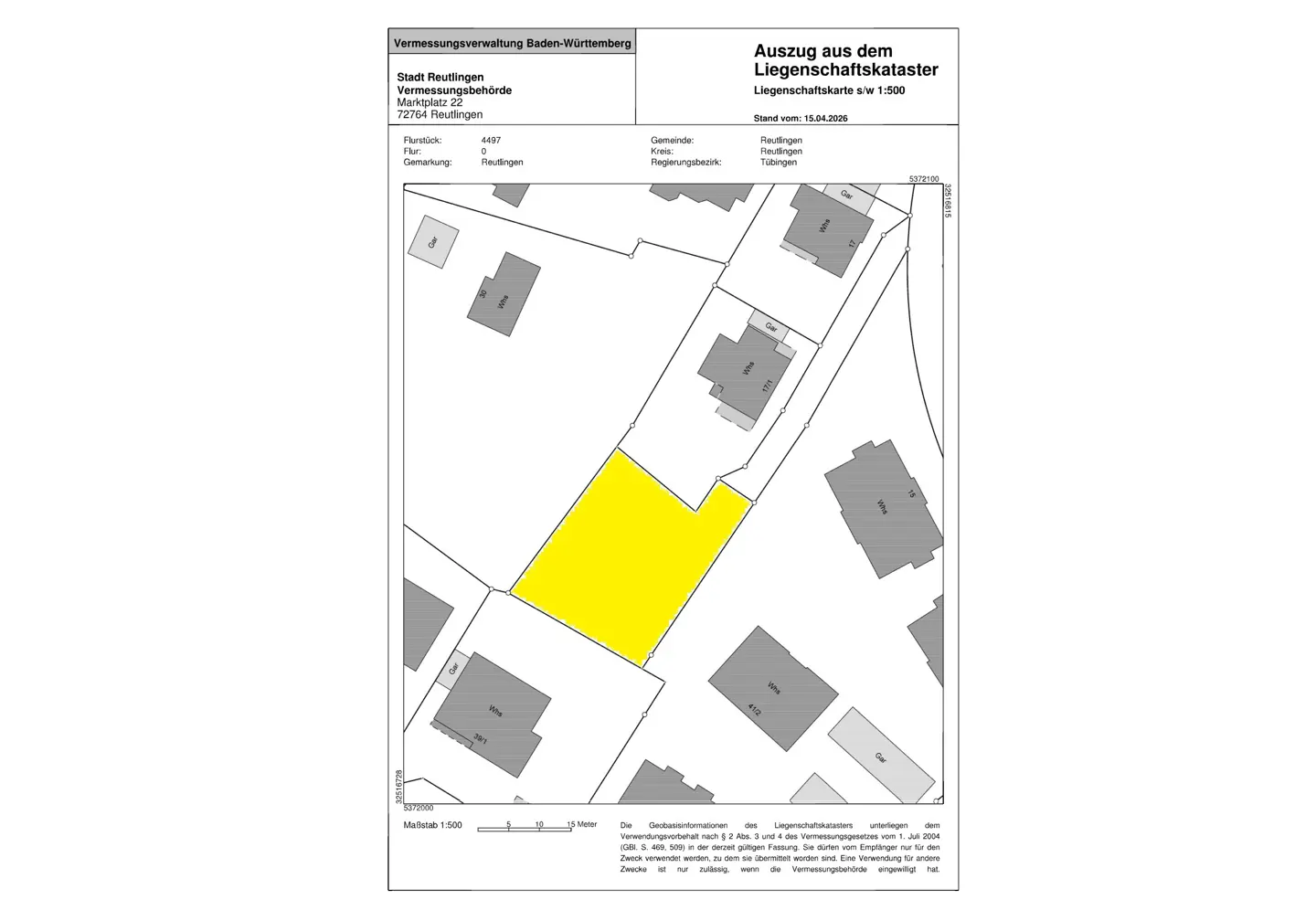 Land registry map showing a yellow plot of land surrounded by gray buildings and streets. Text at the top indicates the source and scale.