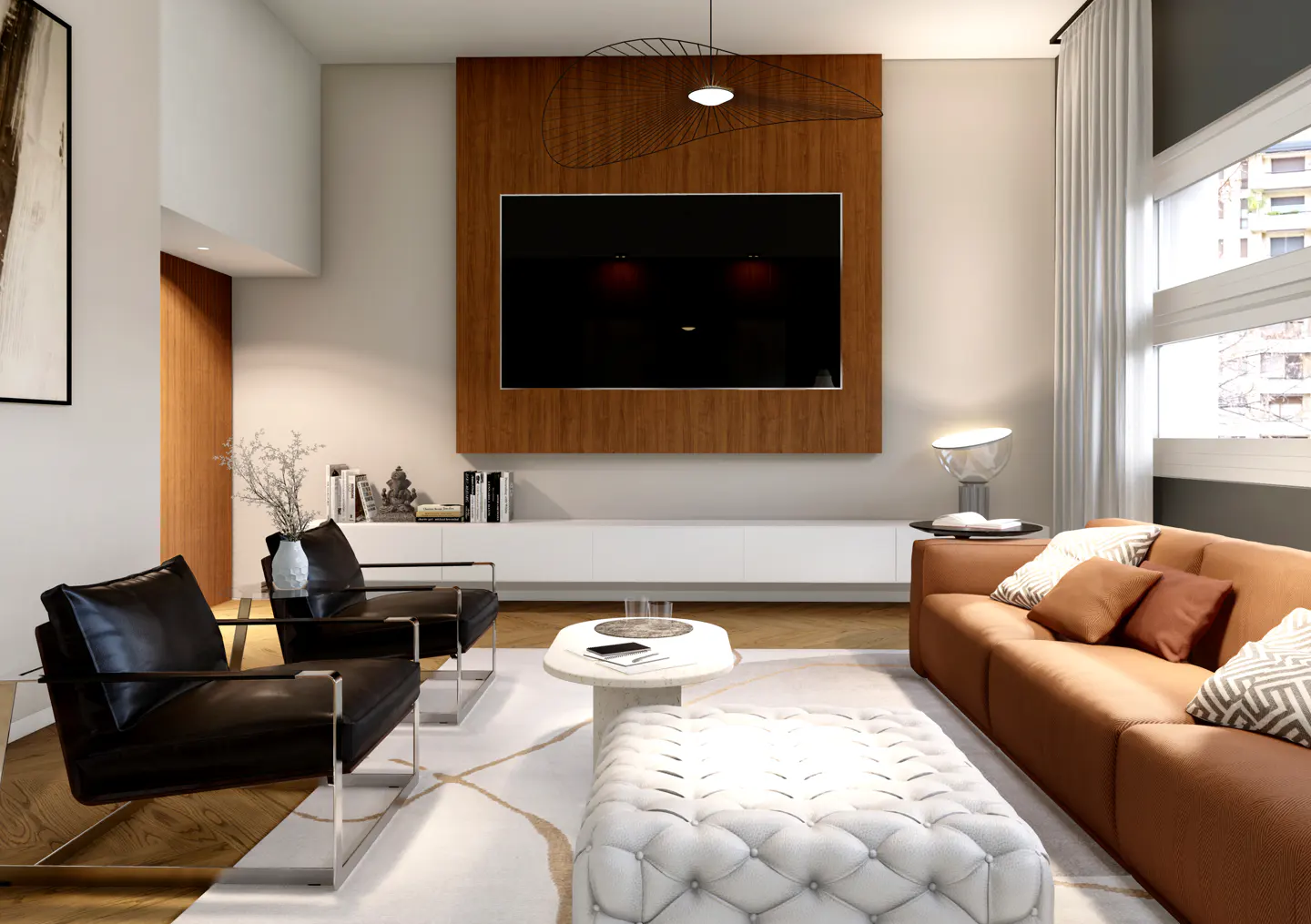 Modern living room with a brown sofa, two black leather chairs, a white tufted ottoman, and a wall-mounted TV on wood panel.