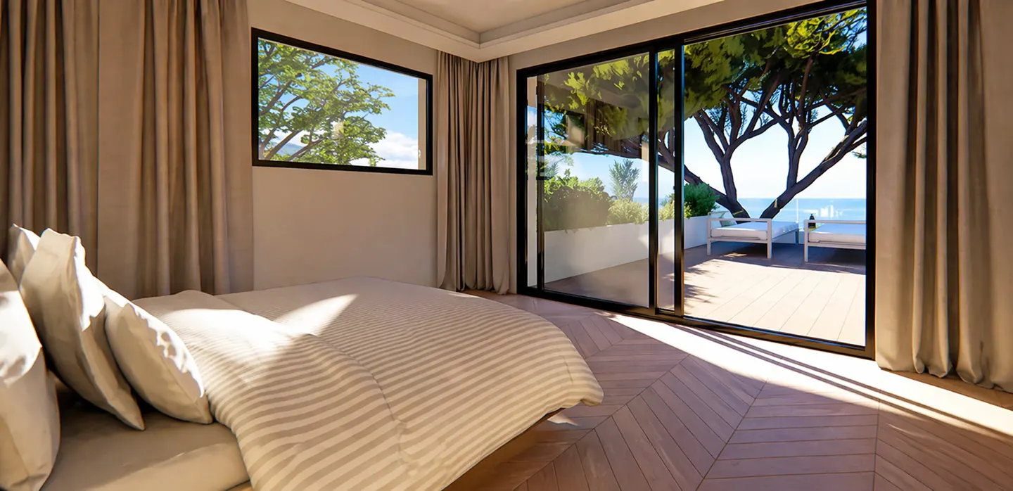 Bedroom with a striped bedspread, beige curtains, and a sliding glass door to a patio with ocean views.