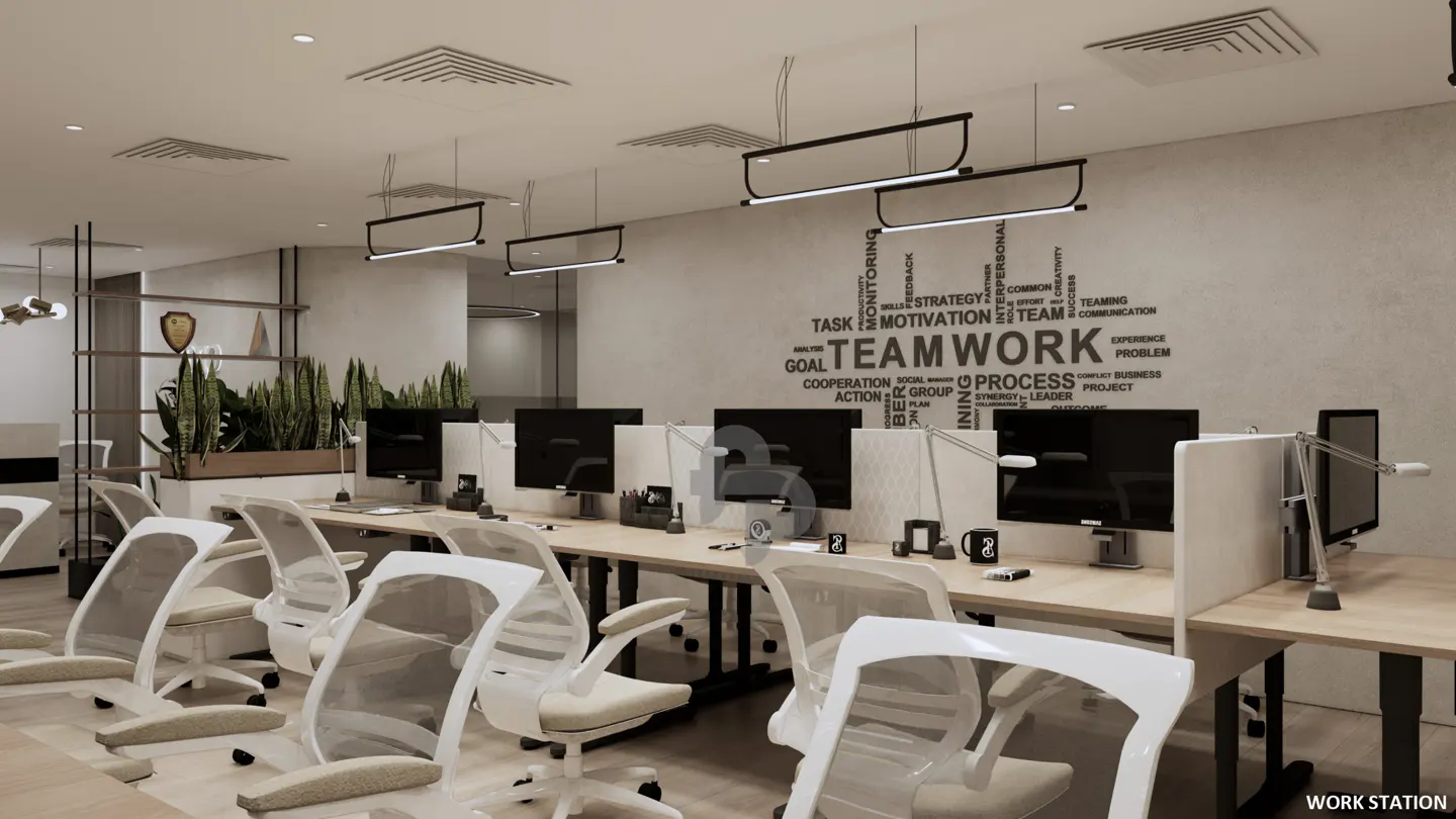 Modern office with rows of desks, white mesh chairs, computer monitors, and a wall featuring a "TEAMWORK" word cloud graphic.
