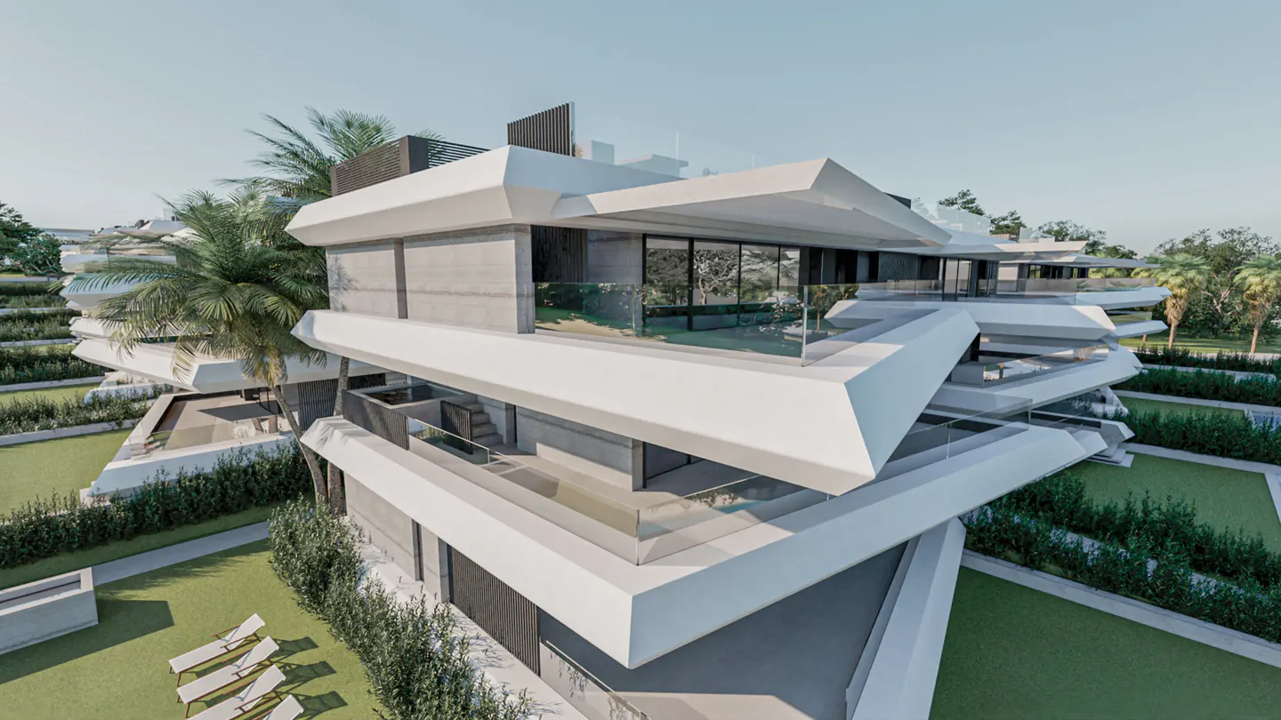 Modern white multi-story building with glass balconies and palm trees. Green lawns and lounge chairs surround the building.