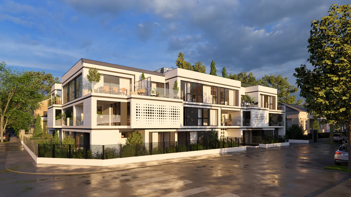 Modern white apartment building with balconies and black accents, surrounded by trees and a black fence.