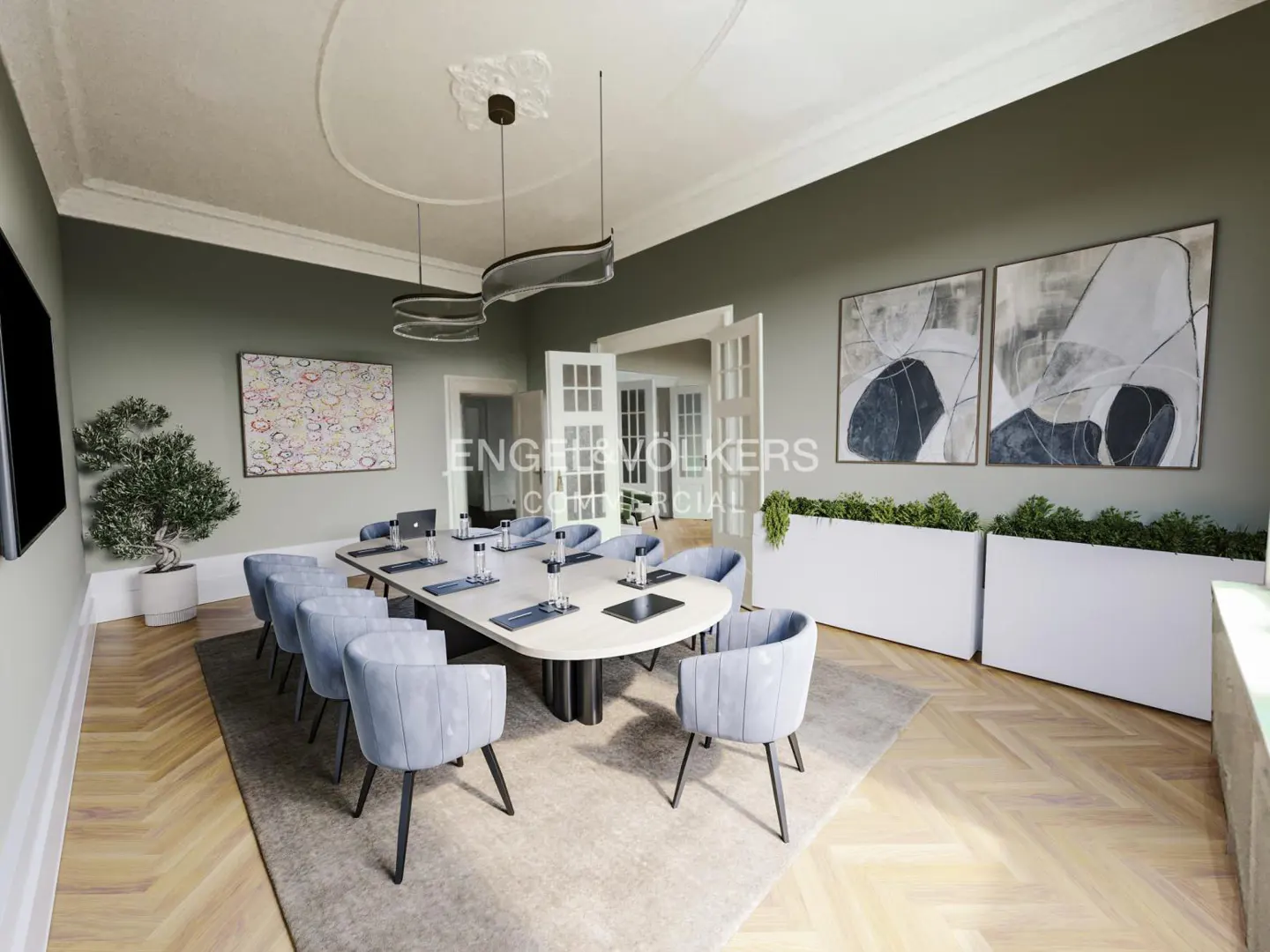 A modern conference room with a long table, blue chairs, and abstract art on the walls.