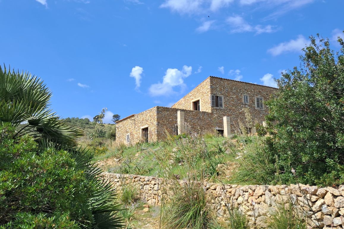 Natural stone finca with renovation potential and distant sea views to Menorca near Artà