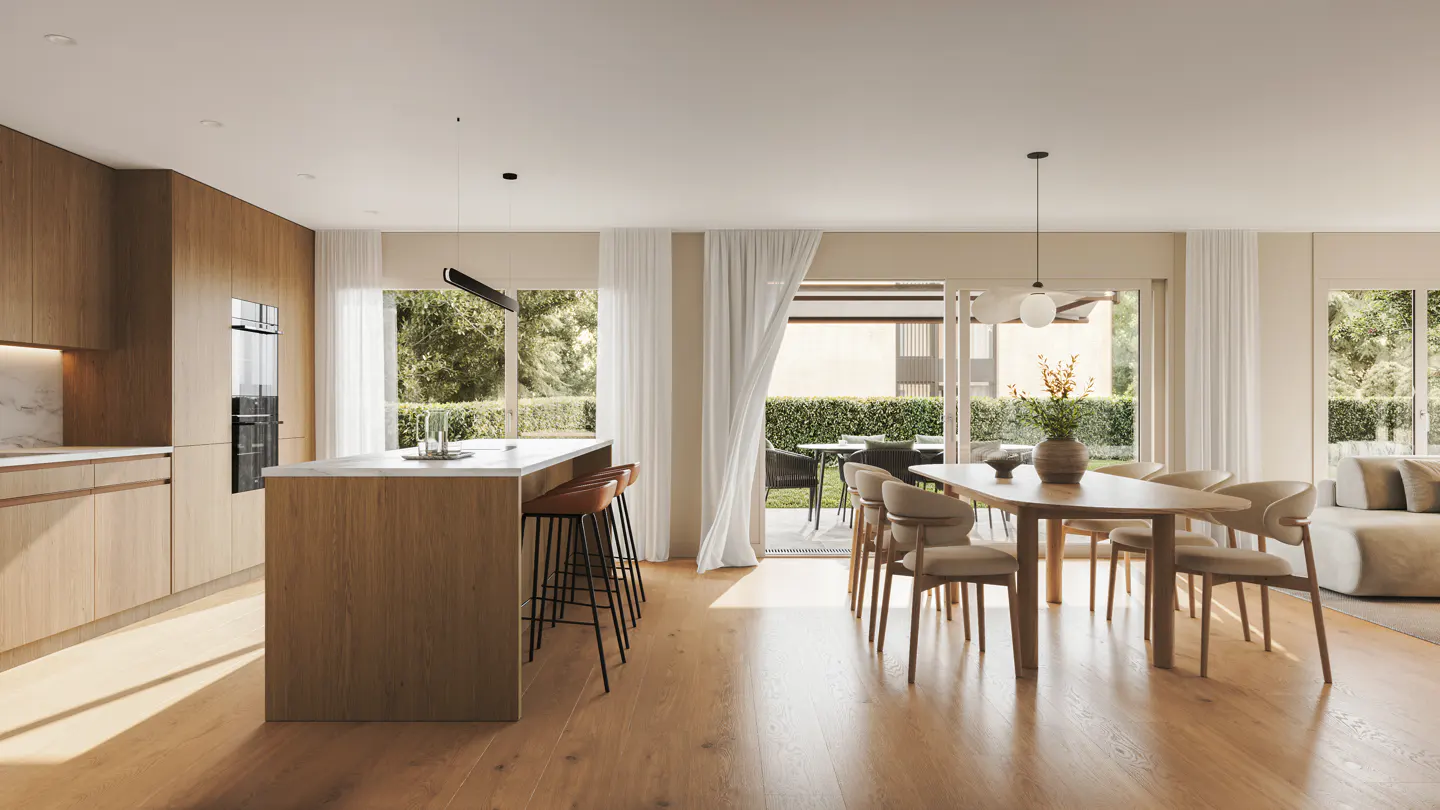 Open-concept kitchen and dining area with wood floors, island with stools, and a dining table with chairs. Sliding doors lead to an outdoor patio.