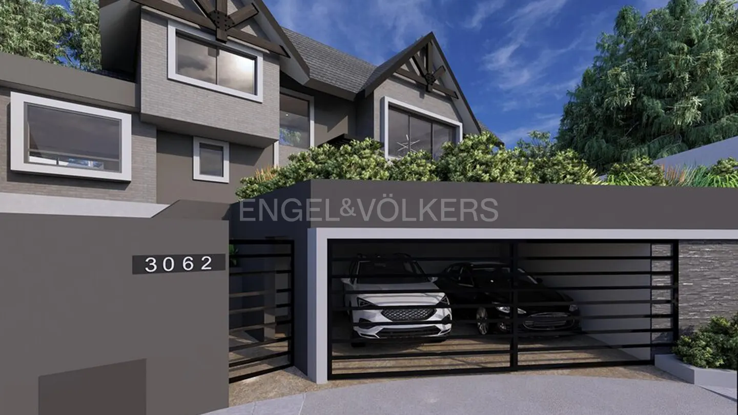Exterior view of a modern gray house with a two-car garage, address number 3062, and Engel & Völkers logo.