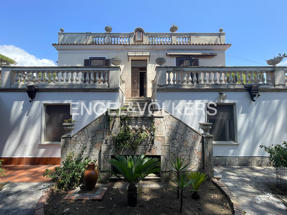 Neoclassical villa surrounded by greenery