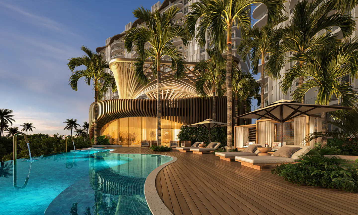 Luxury condo pool area with palm trees, lounge chairs, and cabanas on a wooden deck at dusk.