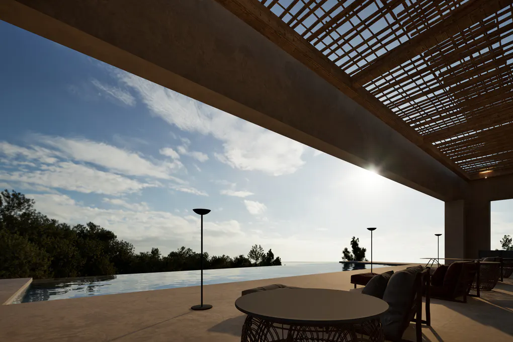 Outdoor patio with a pergola, overlooking a pool and trees under a blue sky. Tables, chairs, and lamps are on the patio.