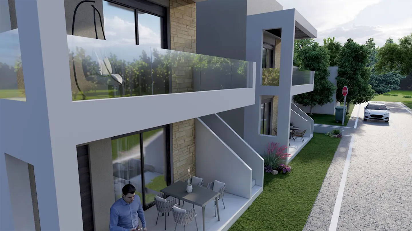 Modern two-story townhouses with glass balconies, stone accents, and ground-floor patios, viewed from the street.
