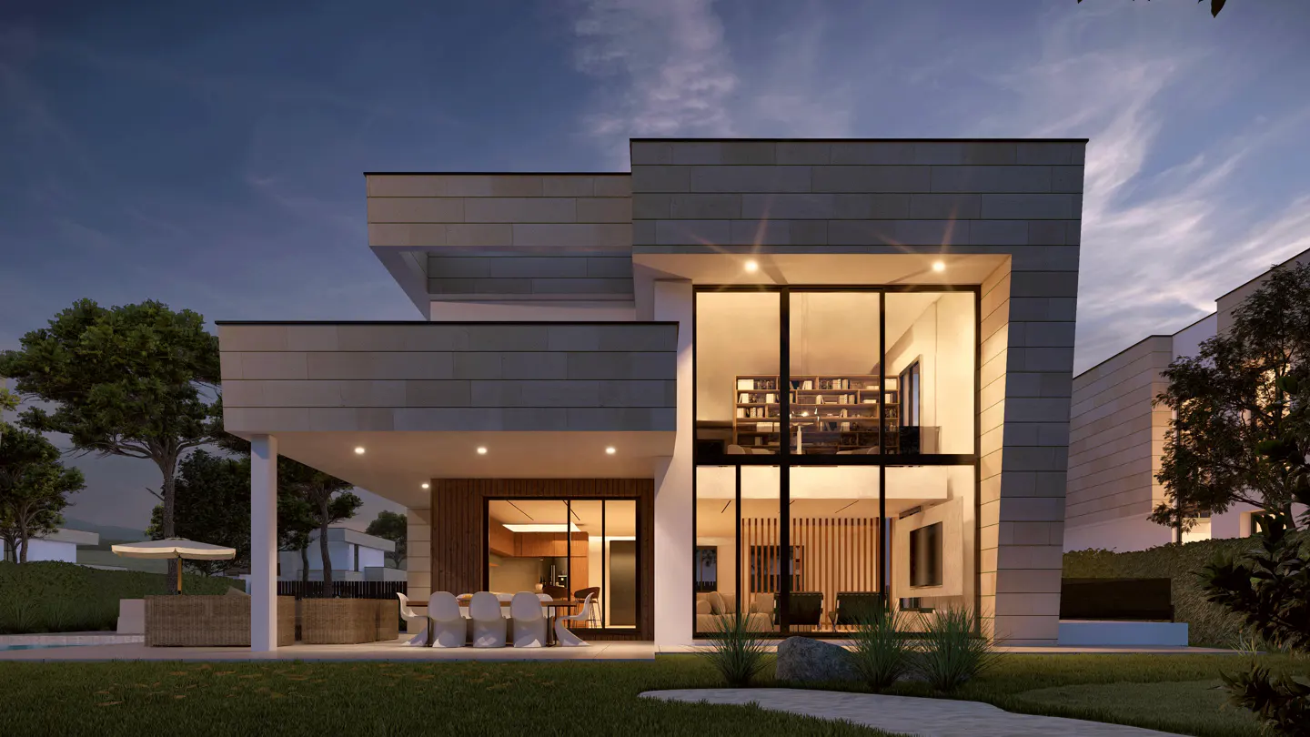 Modern two-story house with large windows, showing a bookshelf and living room. Outdoor patio with table and chairs. Green lawn and trees.