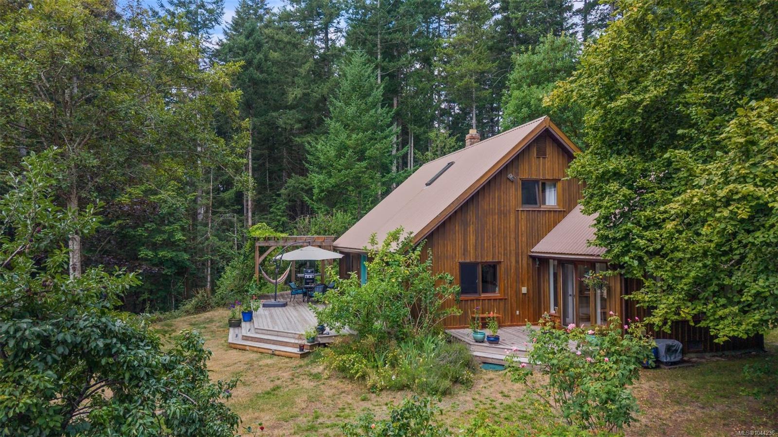 This Denman Isle home feels like a hidden storybook retreat!