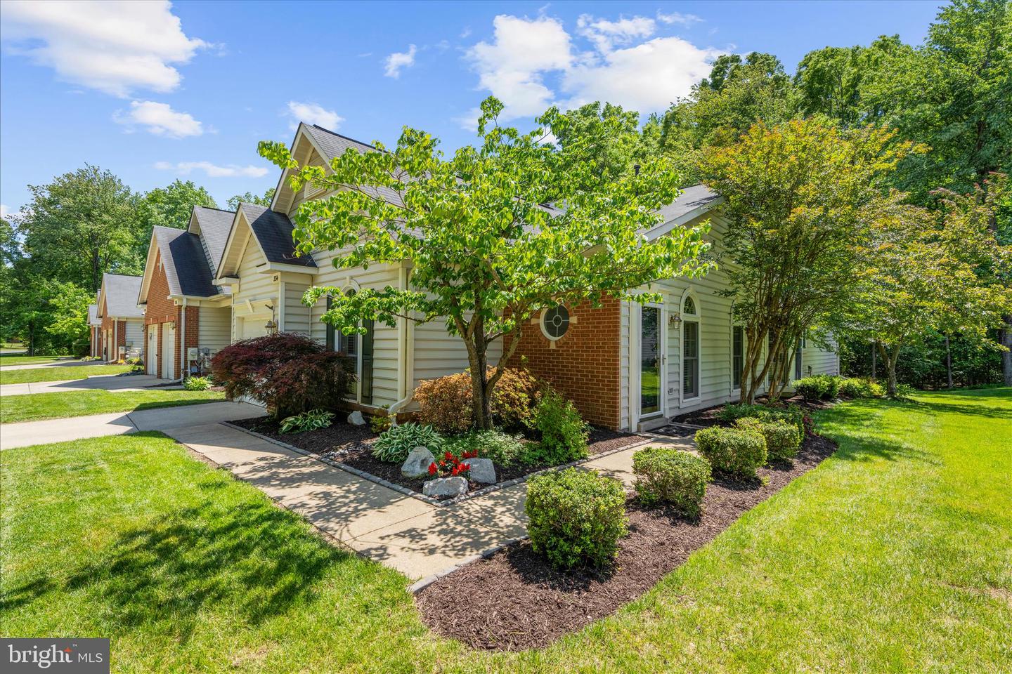 Exceptional End Unit with Peaceful Tree-Lined Views