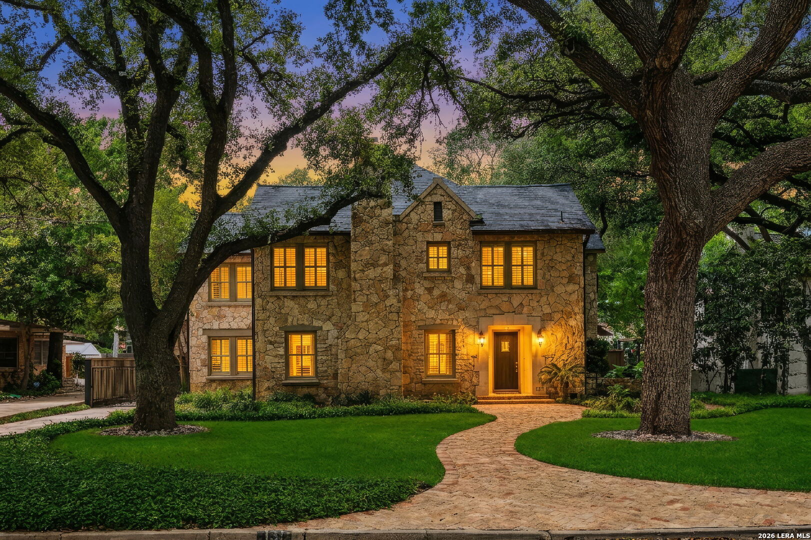 Stone Home on Tree-Lined Street