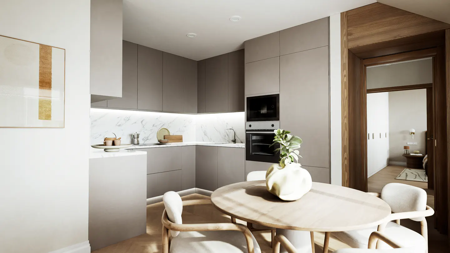 A modern kitchen with gray cabinets, marble backsplash, and a round wooden table with four chairs. A doorway leads to a bedroom.
