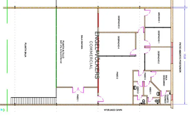 Floor plan of a commercial space with offices, bathrooms, and an open patio, labeled with room names and dimensions.