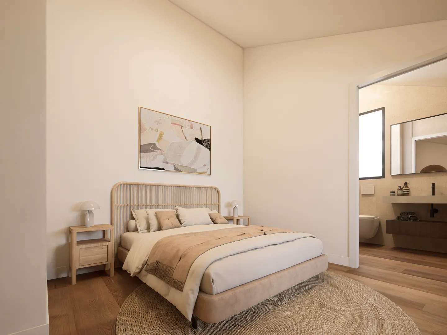Bedroom with a rattan headboard bed, beige blanket, and a round rug. An abstract painting hangs above the bed. A bathroom is visible through a doorway.